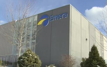 A large, grey building with a logo that reads, "Emera", on the front.